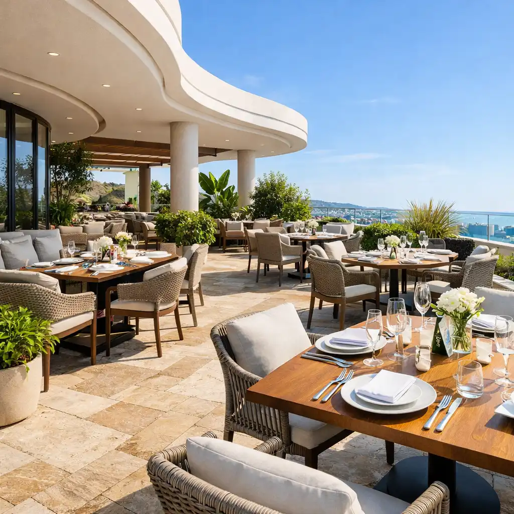 Daylight view of the dineterrace dining area with tables set and curved architectural lines
